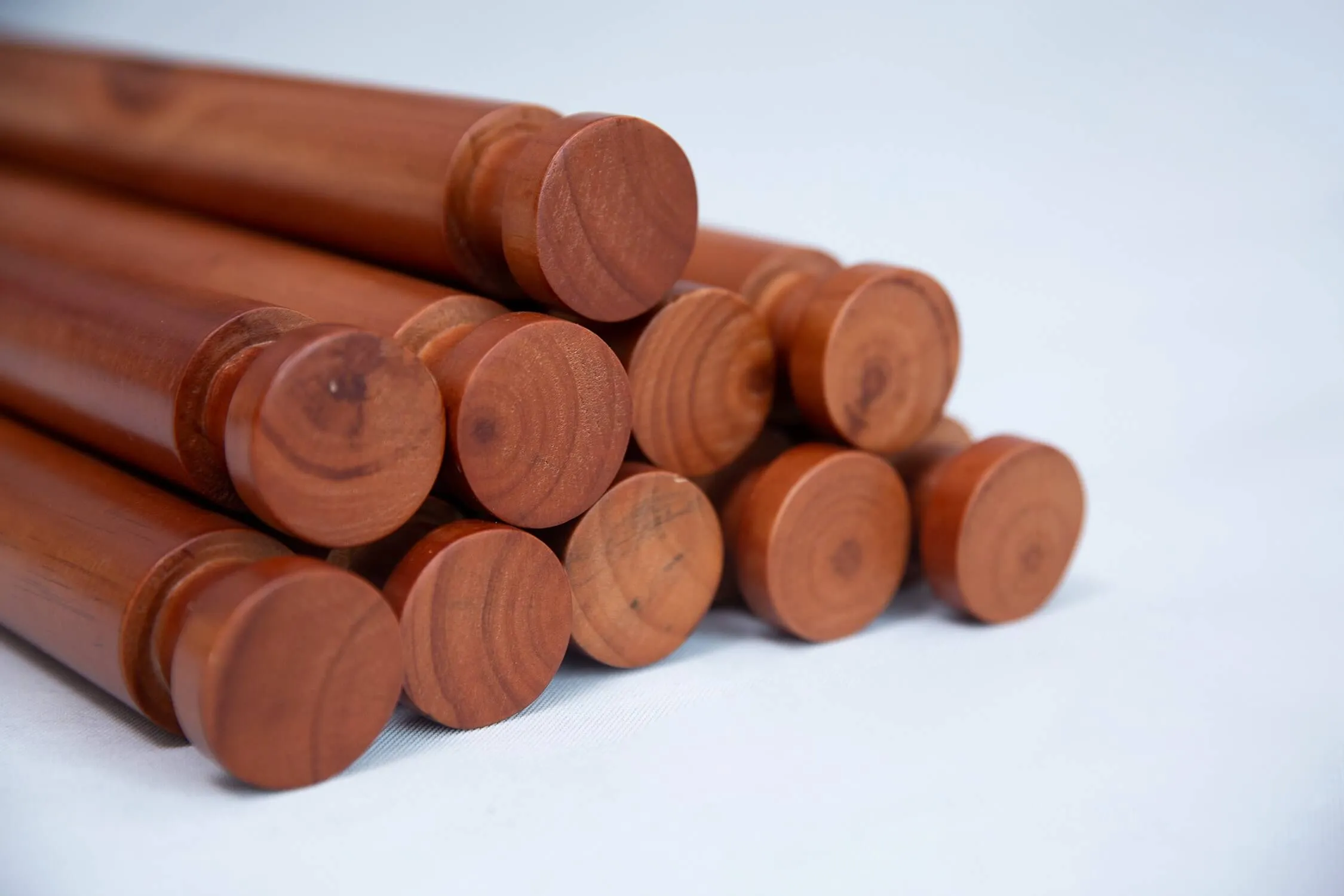 Close-up of the turned wooden bar ends and scalloped side panel