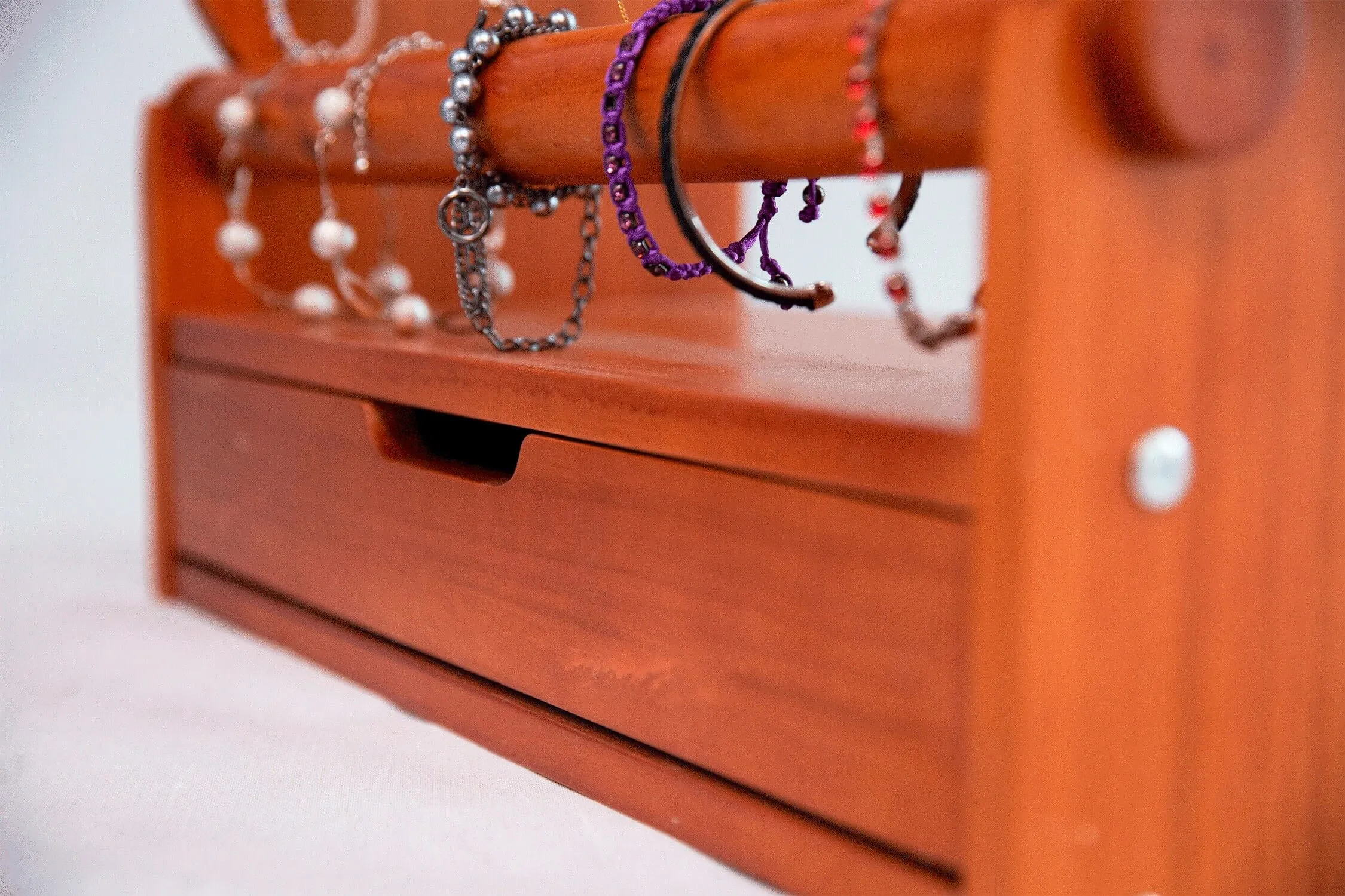 Close-up of the built-in base drawer pulled open beneath the loaded display